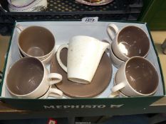 A small quantity of Poole Pottery cups, saucers,