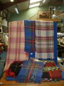 A quantity of travel rugs and picnic blankets.
