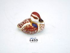 A Royal Crown Derby duck paperweight having a gold stopper.