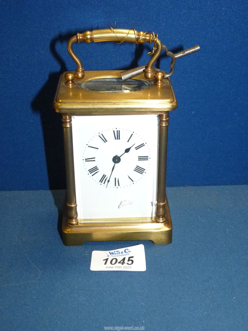 A Brass Carriage clock with Roman numerals and bevelled glass, - Image 2 of 3