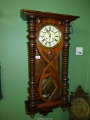 An early 1900's Gustav Becker chiming Wall Clock, 32'' tall plus finials,