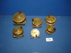Six brass Fishing reels, one by A.W. Gamage Ltd., The Milbro, etc., in various sizes.
