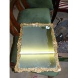A Wall mirror with elaborate gilded frame, 22'' x 16'', a/f.