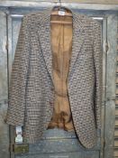 A Moss Bros single breasted gentleman's jacket in Harris tweed, double vented, size L (42" chest).