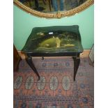 A black lacquered rectangular occasional Table standing on cabriole legs and having chinosierie