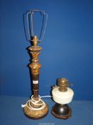 Two lamps, being an oil lamp and an electric wooden lamp. 22 1/2" x 11 1/2".