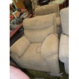 A pair of beige upholstered contemporary reclining Fireside Chairs having integral rise and fall