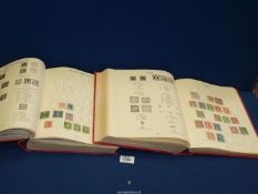 Two volumes of British Commonwealth stamps containing around 600 stamps from the reigns of Queen