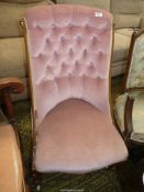 An elegant Victorian Walnut show frame Nursing Chair, button backed pink upholstered,
