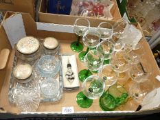 A quantity of Hock glasses having green and amber stems together with dressing table set pieces.