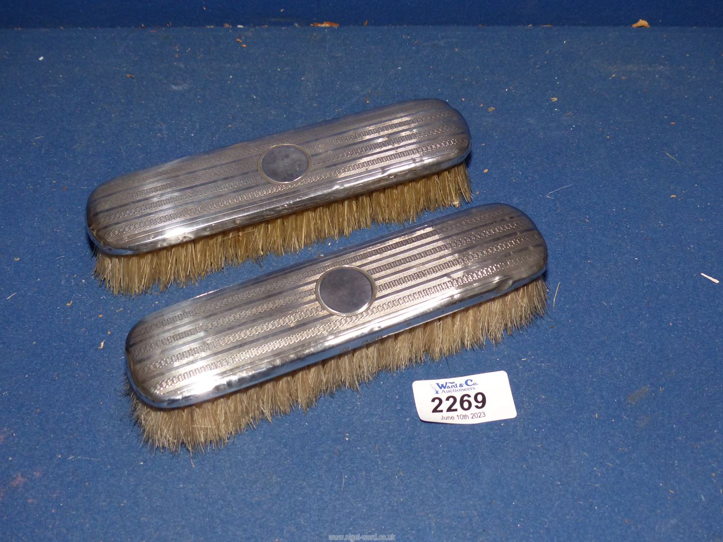 A pair of silver backed Brushes, Chester 1912, makers mark S. B. (Synyer & Beddoes).