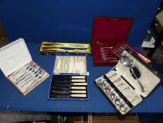 A quantity of boxed silver plate including Community plate cake forks, set of fruit spoons,