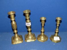 Two pairs of brass candlesticks; 6" and 8" tall.