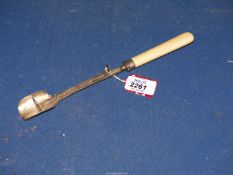 A bone handled Silver Stilton scoop with pusher, Birmingham 1869 (split in handle).