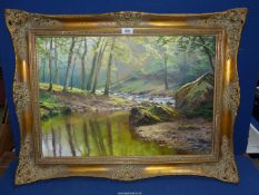 A large ornate gilt framed Oil on canvas depicting a river meandering through a wooded glade,