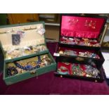 Two jewellery boxes with costume jewellery.