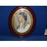 An early 20th century oval Watercolour portrait of a woman, signed Taylor.