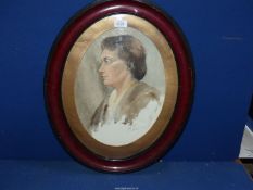 An early 20th century oval Watercolour portrait of a woman, signed Taylor.