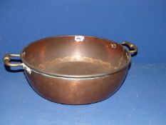 A copper jam pan,