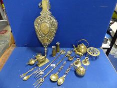 A box of mixed brass including; two toasting forks, bellows, small teapots, door stop,