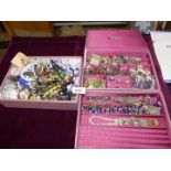 A large quantity of costume jewellery including necklaces, glass beads, metal bracelets, rings,