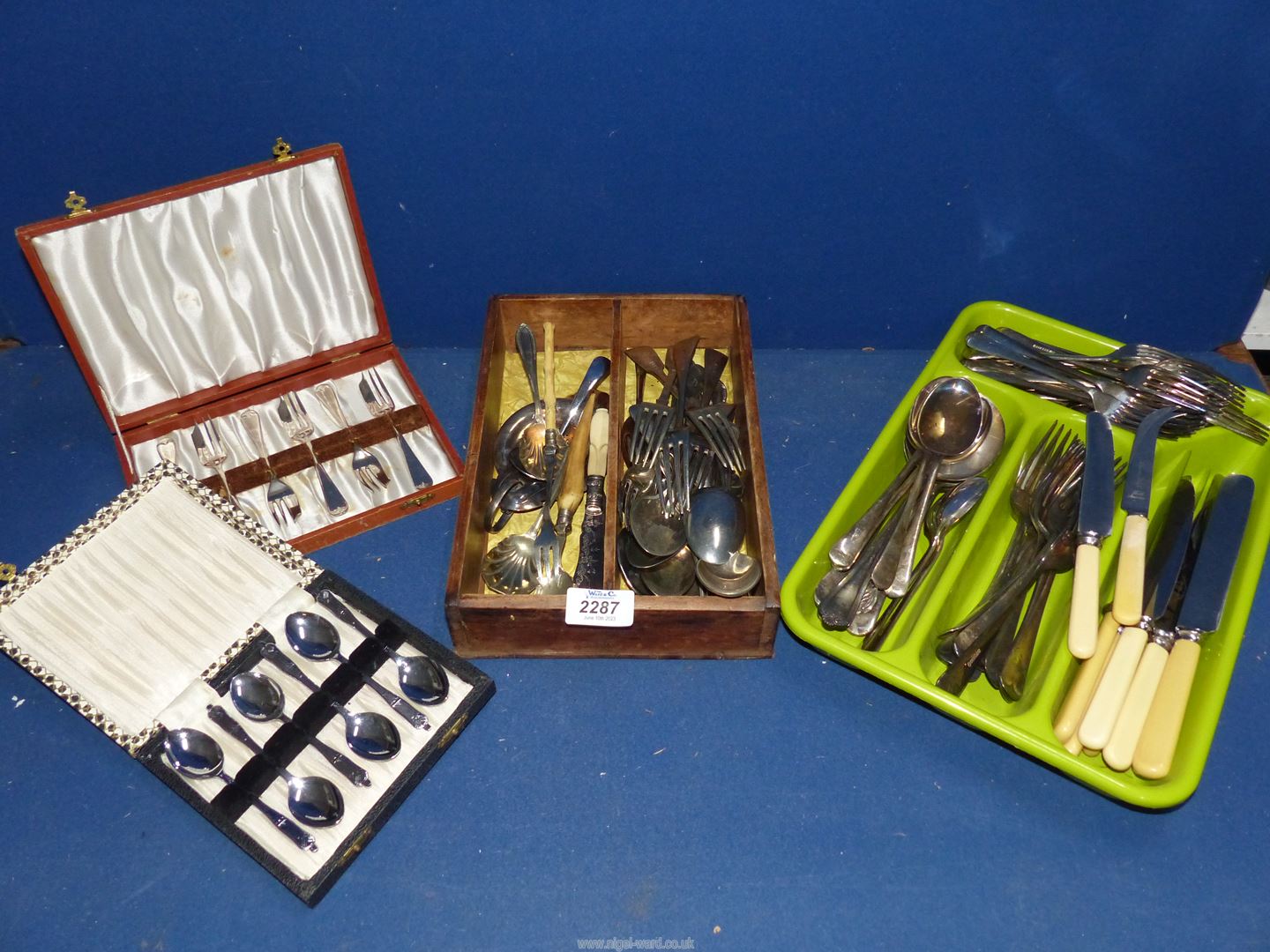 A quantity of miscellaneous plated cutlery including forks, knives,