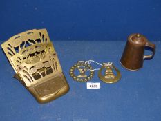 A Brass Art Nouveau letter rack, copper lidded tankard and two horse brasses.