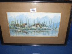 A framed and mounted Watercolour of a river scene with thatched huts and figures,
