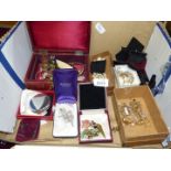 A quantity of costume jewellery in a jewellery box including simulated pearls, earrings, necklaces,