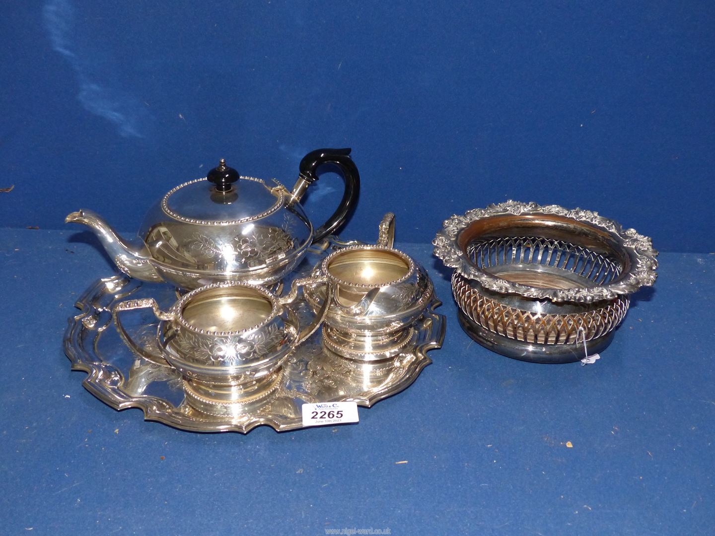 A Georgian silver plated on copper Champagne Holder and a silver plated three piece tea service