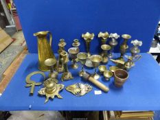 A quantity of brass including candlesticks, ale jug, mini anvil, goblets etc.