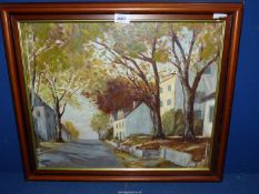 A framed Oil on board of street with trees and houses on both sides, signed lower left Guy Robson,