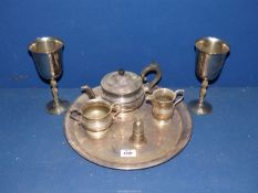 A quantity of plated items including teapot, sugar bowl, milk jug, salt cellar,