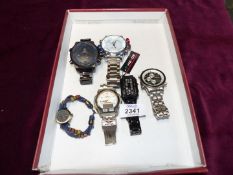 Six wristwatches including; Timex 'Ironbru' Indiglo, a black Binary watch, Accurist, Weide,