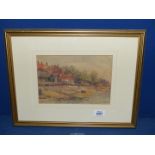 A framed and mounted Watercolour of a beach scene with beached rowing boat and buildings,