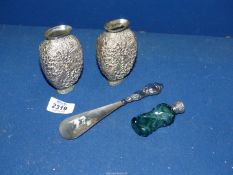 Two small white metal vases and scent bottle having green glass with silver top (unmarked,