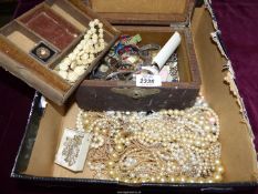 A brown leather jewellery box and contents of cufflinks, wristwatches, buttons, beads etc.