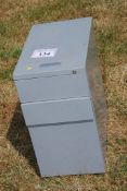A three drawer filing cabinet.