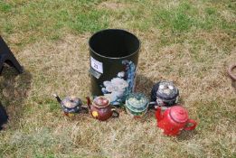 A quantity of bargeware including bin, pot lid and four teapots.