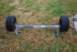 A trailer axle with 500-8 wheels/tyres.