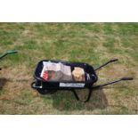 A new black Wheelbarrow with pneumatic tyre, kindly donated by Robert Price,