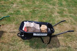A new black Wheelbarrow with pneumatic tyre, kindly donated by Robert Price,