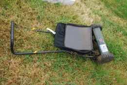 A Tesco push cylinder Mower with collecting box.