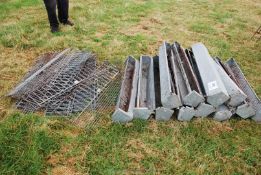 Quantity of galvanised chicken feeders with mesh fronts.