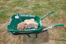 A new Green heavy duty builders Wheelbarrow, kindly donated by Travis Perkins,