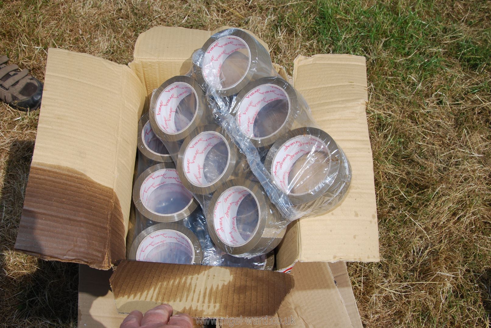 A quantity of brown packing tape and plastic re sealable.