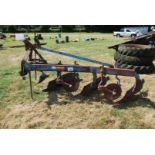 A Ransomes' three-furrow conventional plough.