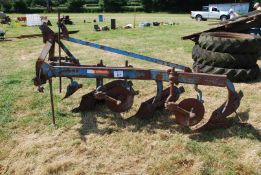 A Ransomes' three-furrow conventional plough.
