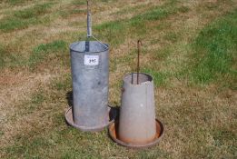 Two galvanised chicken feeders.