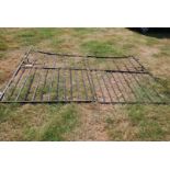 A pair of large and imposing wrought iron driveway gates and hinges, 7 ft high at hinge ends,
